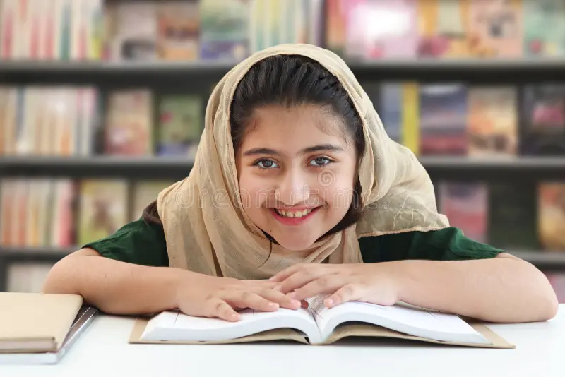 adorable-smiling-pakistani-muslim-girl-beautiful-eyes-wearing-hijab-studying-doing-homework-table-happy-student-kid-241767556